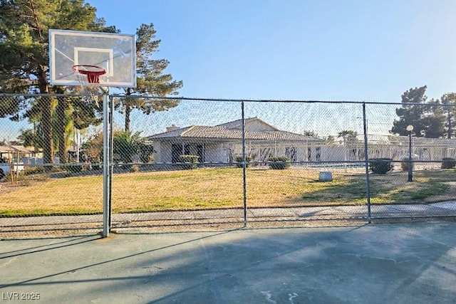 exterior space with basketball court and a front yard