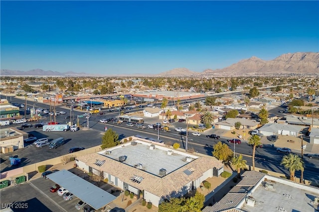 birds eye view of property featuring a mountain view