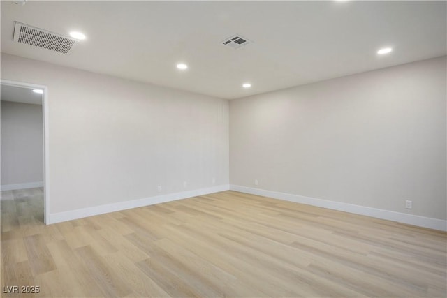 unfurnished room featuring light hardwood / wood-style floors