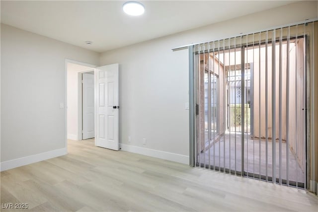 spare room featuring light hardwood / wood-style flooring