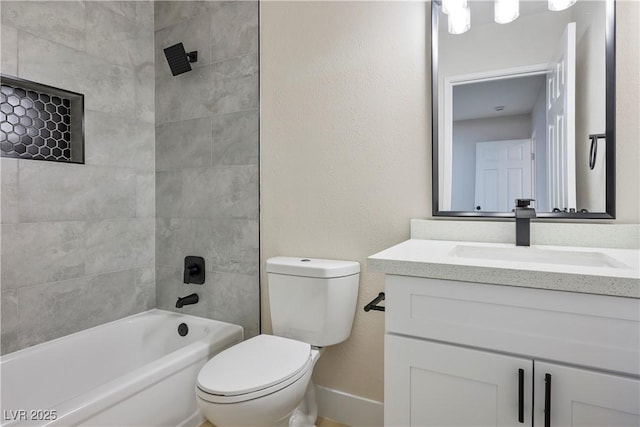 full bathroom featuring vanity, toilet, and tiled shower / bath combo