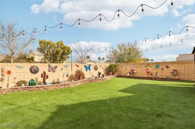 view of yard featuring a fenced backyard