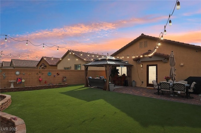 exterior space featuring a gazebo, a yard, and a patio