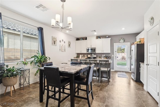 dining room with recessed lighting, visible vents, a notable chandelier, and baseboards