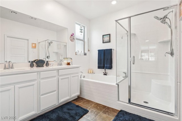 full bathroom with visible vents, a sink, a bath, and a shower stall