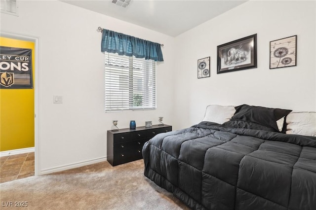 bedroom with carpet, visible vents, and baseboards