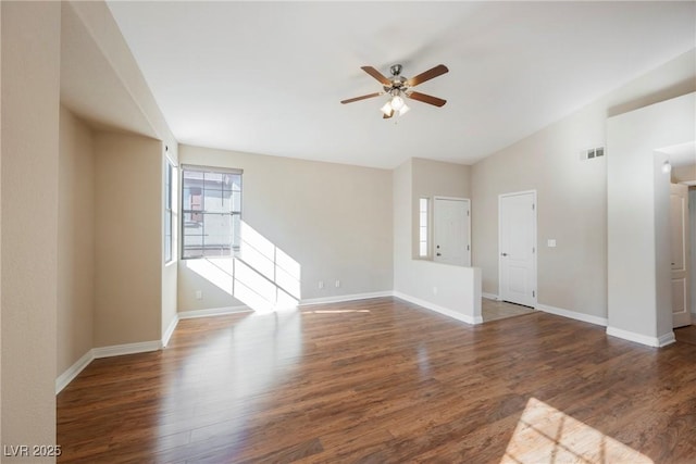 unfurnished living room with dark hardwood / wood-style flooring, lofted ceiling, and ceiling fan