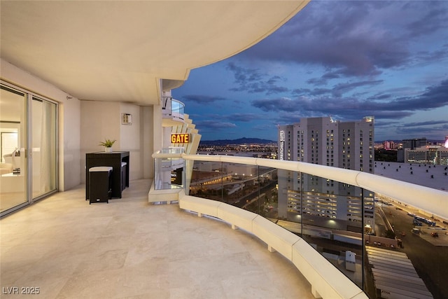 view of balcony at dusk