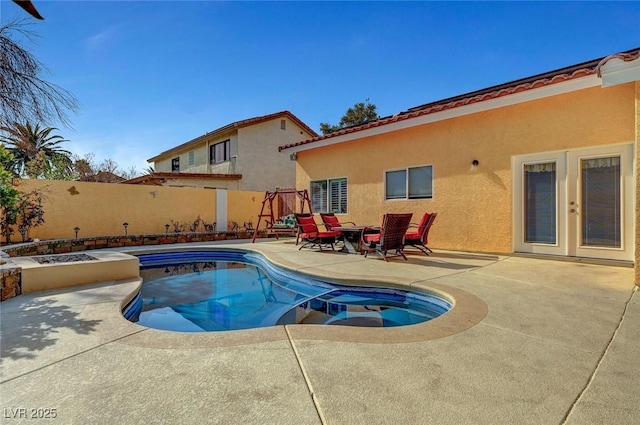 view of pool featuring a patio area