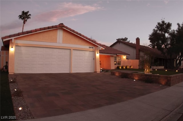 view of front of property with a garage