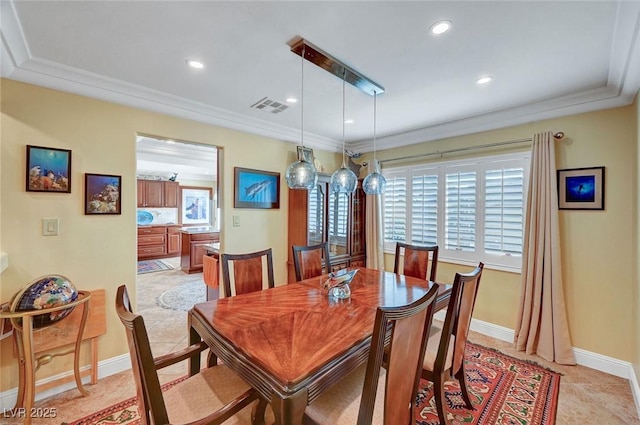 dining space with ornamental molding and light tile patterned flooring