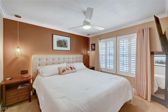 bedroom featuring crown molding, light colored carpet, and ceiling fan