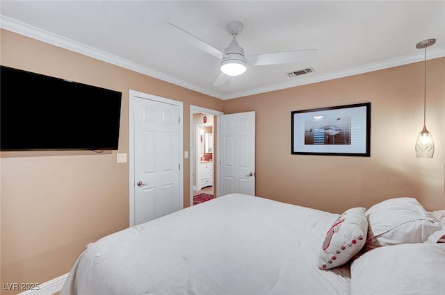 bedroom with ceiling fan and ornamental molding