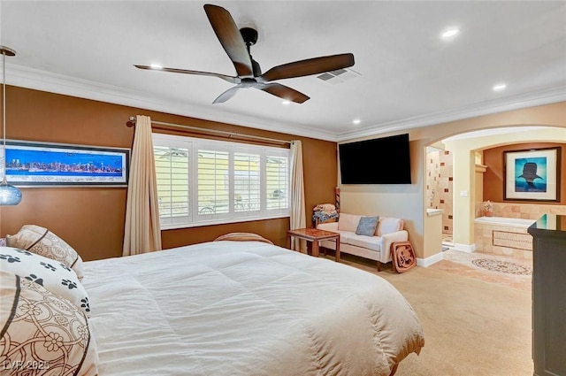 bedroom with carpet floors, ornamental molding, ceiling fan, and ensuite bathroom