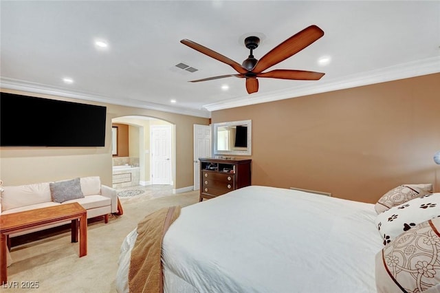 carpeted bedroom featuring crown molding, connected bathroom, and ceiling fan