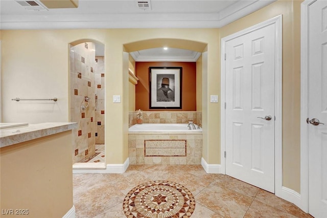 bathroom with crown molding and separate shower and tub