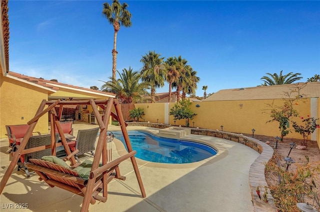 view of swimming pool featuring a patio