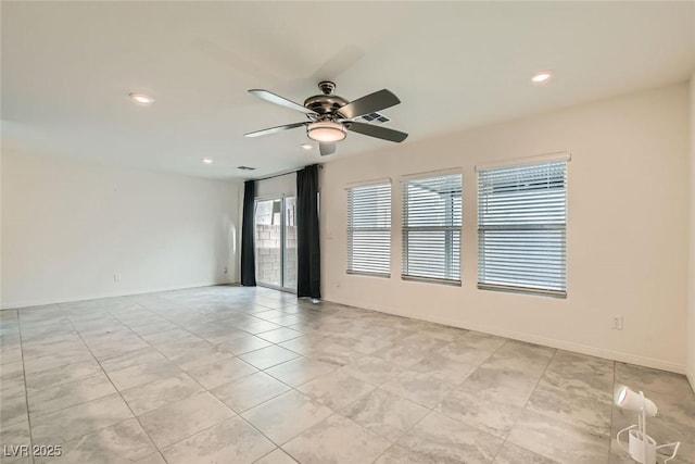 spare room featuring ceiling fan