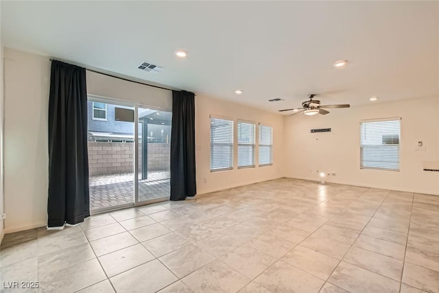 spare room with ceiling fan