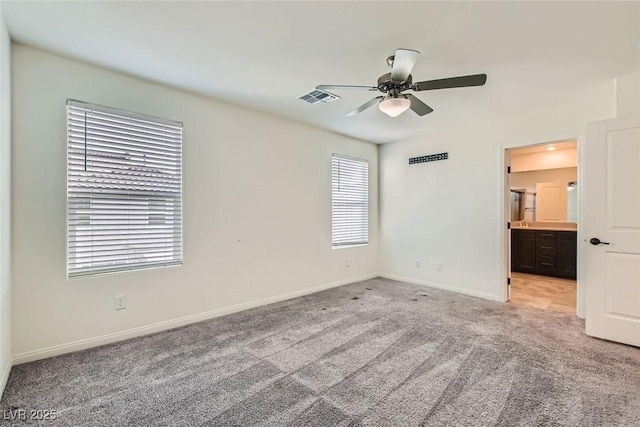 empty room with light carpet and ceiling fan