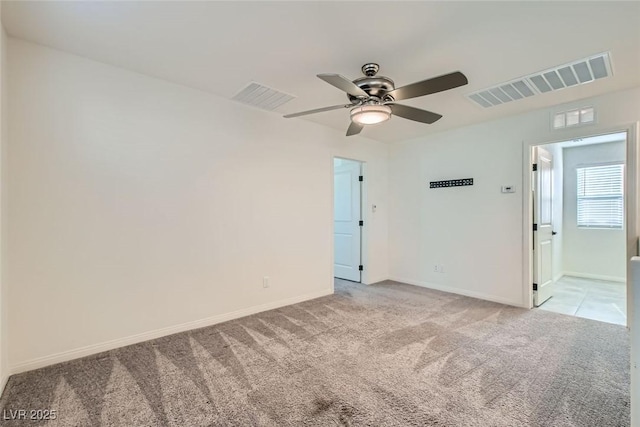 carpeted empty room with ceiling fan