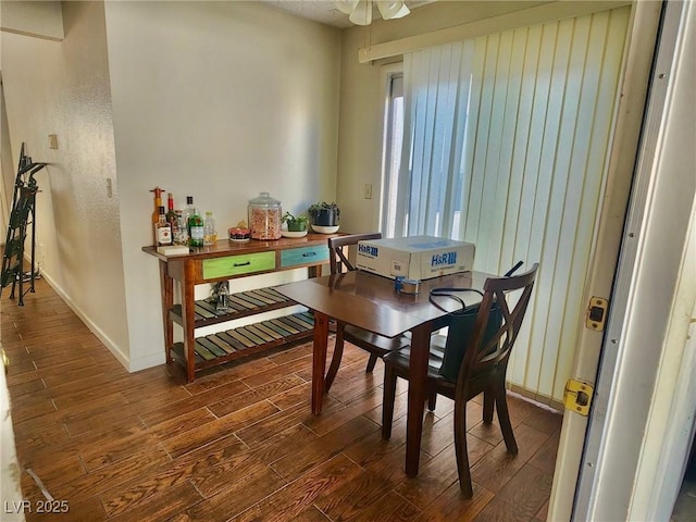 dining space featuring dark wood-type flooring