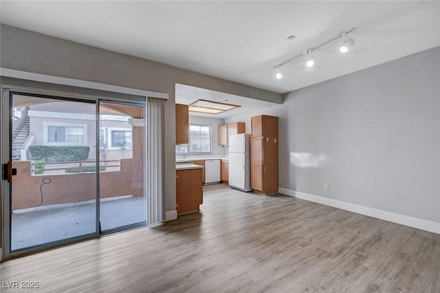 unfurnished living room featuring light wood-type flooring