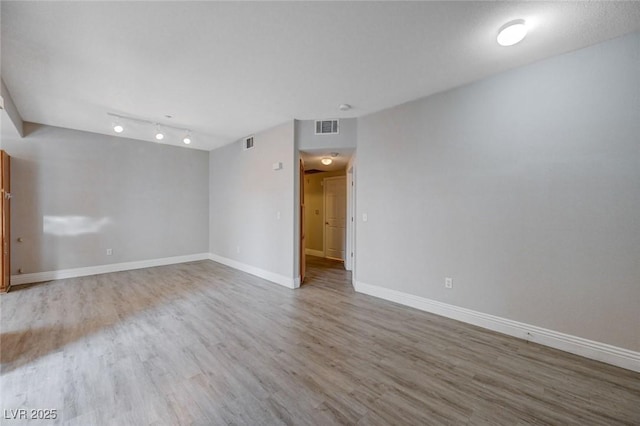 empty room with wood-type flooring