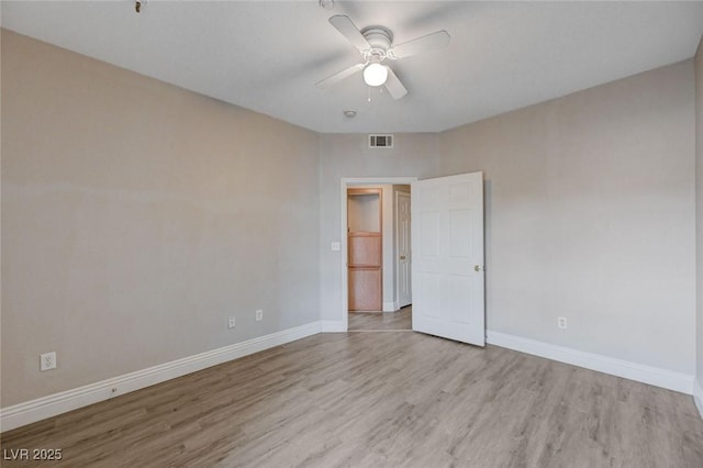 unfurnished room featuring ceiling fan and light hardwood / wood-style floors