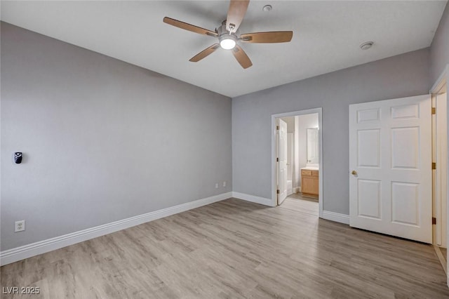 unfurnished bedroom with ceiling fan, light wood-type flooring, and ensuite bath