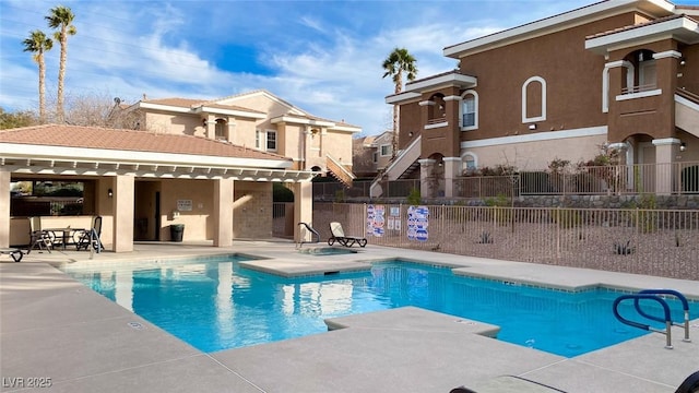 view of swimming pool with a patio