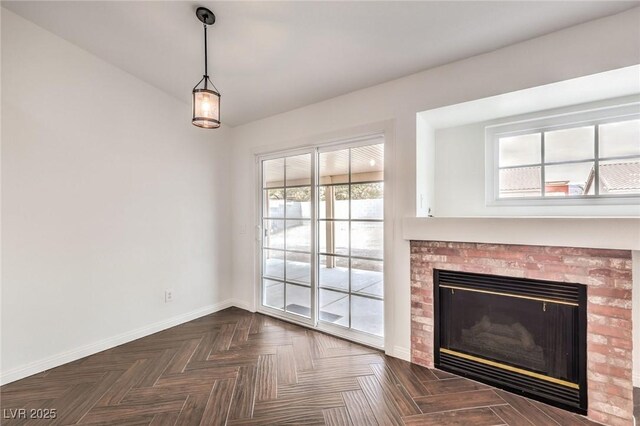 unfurnished living room featuring dark parquet floors