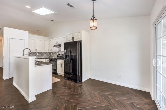 kitchen featuring pendant lighting, dark parquet floors, gas range oven, white cabinets, and black fridge with ice dispenser