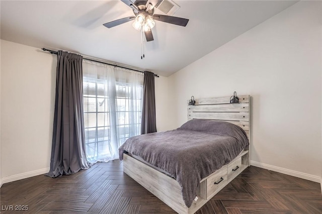 bedroom featuring ceiling fan, lofted ceiling, and dark parquet flooring