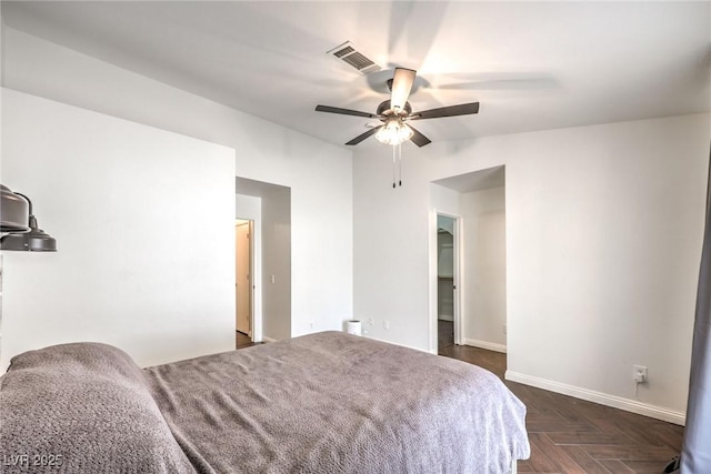 bedroom featuring dark parquet floors and ceiling fan