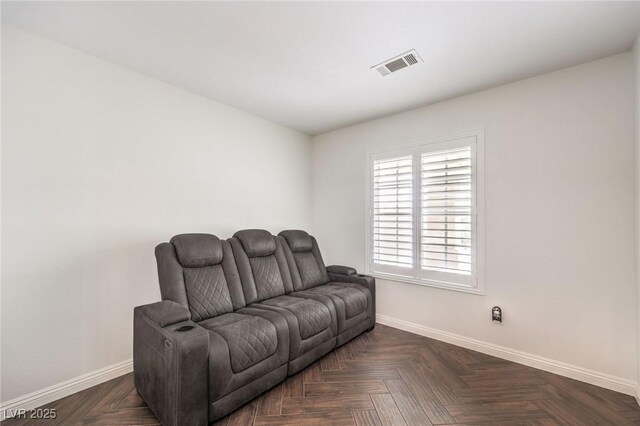 sitting room with dark parquet floors