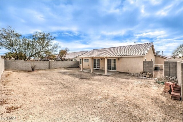 back of house with a patio area