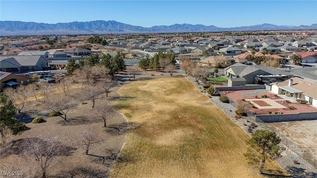 birds eye view of property with a mountain view and a residential view