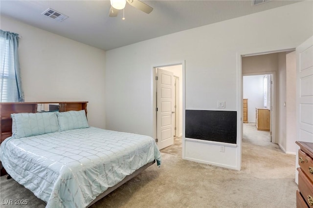 bedroom with light carpet, visible vents, and a ceiling fan