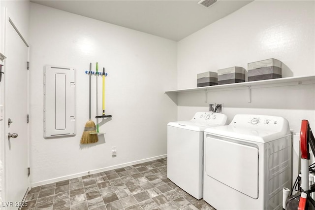 washroom featuring visible vents, baseboards, electric panel, laundry area, and independent washer and dryer