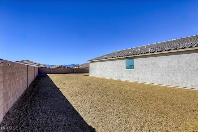 view of yard with a fenced backyard