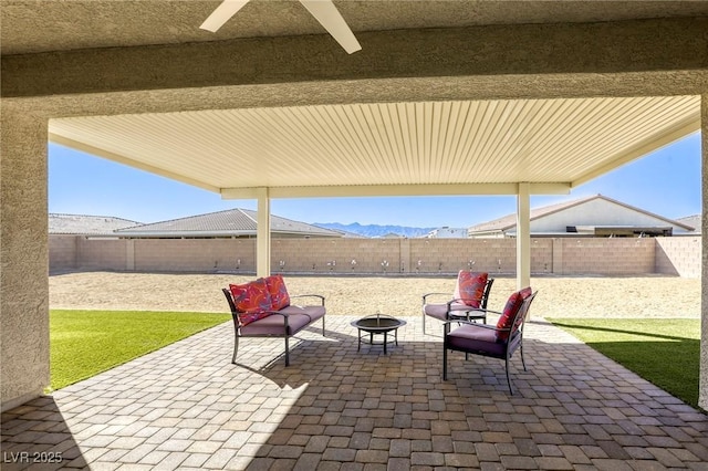 view of patio / terrace featuring a fenced backyard and an outdoor fire pit