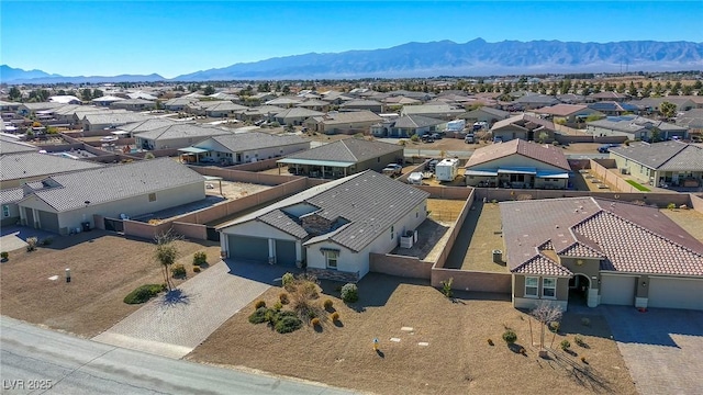 aerial view featuring a mountain view and a residential view