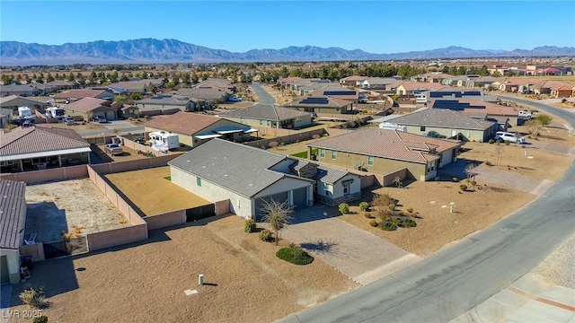 birds eye view of property featuring a mountain view and a residential view