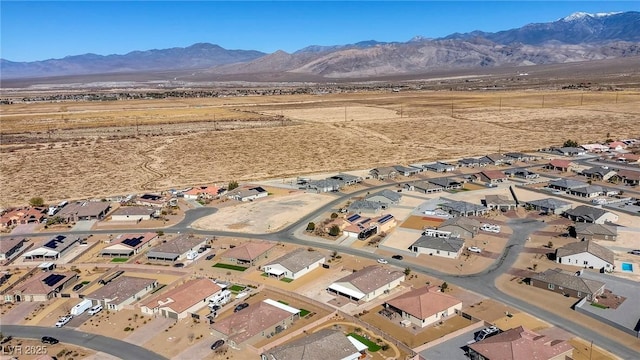 birds eye view of property with a mountain view and a residential view