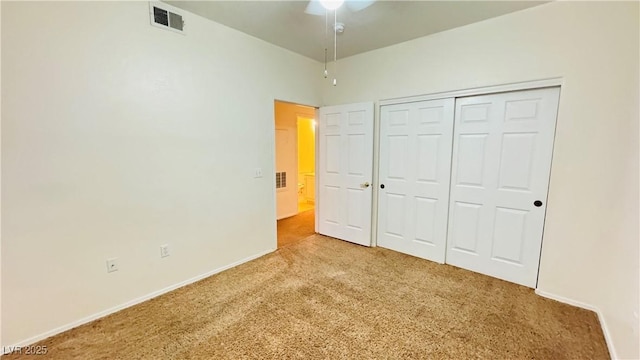 unfurnished bedroom with carpet floors and a closet