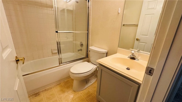 full bathroom featuring vanity, toilet, and combined bath / shower with glass door