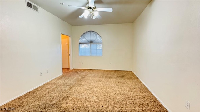 unfurnished room featuring ceiling fan and light colored carpet