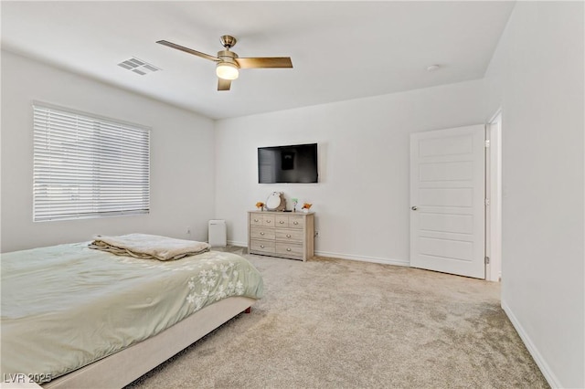 bedroom featuring ceiling fan and light colored carpet