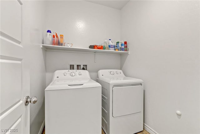 laundry room with separate washer and dryer